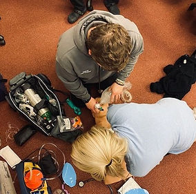 Staff Giving First Aid To A Doll Demonstration